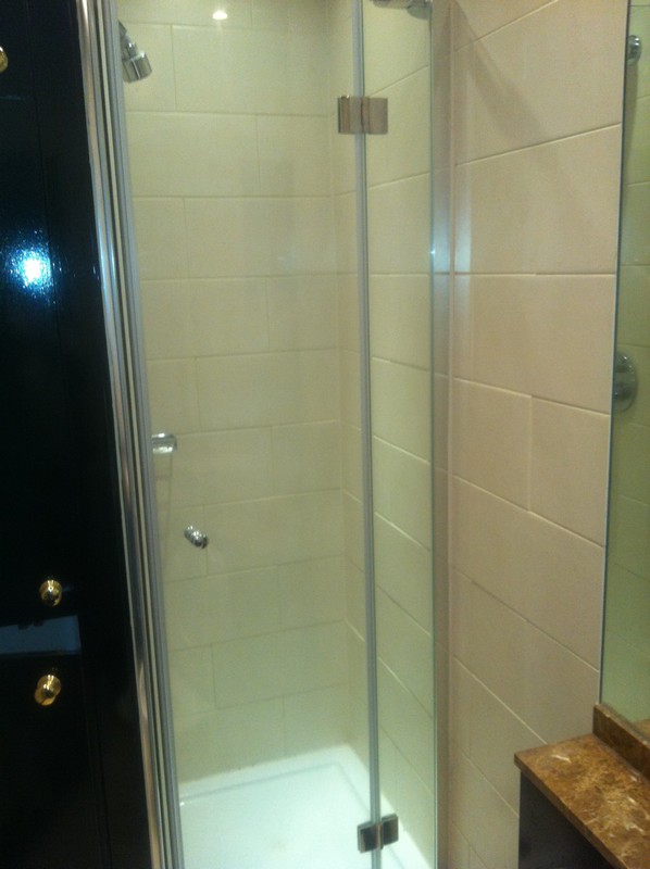 Frameless glass shower enclosure with chrome fittings in Plaistow